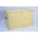 A wooden chest, painted cream, with twin handles. 45cm high by 75cm wide