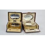 Two 19th century silver brush and mirror travelling sets in original box , one tortoiseshell and