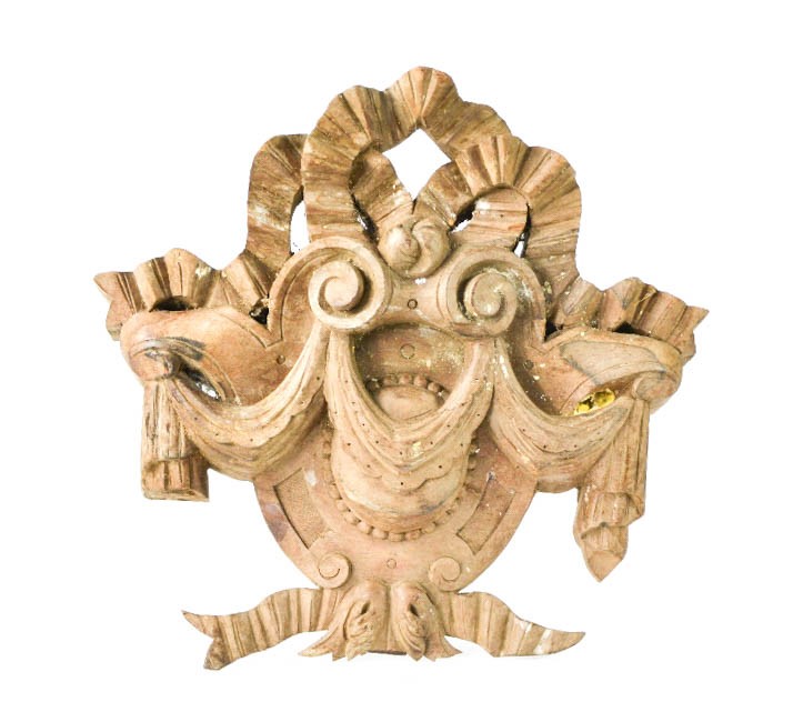 A French 19th century oak section of carving, composed of bows and swags surrounding shield form