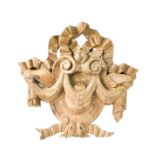 A French 19th century oak section of carving, composed of bows and swags surrounding shield form