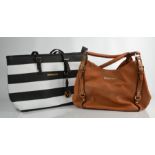 A Michael Kors tan hand bag, together with a Michael Kors style beach type bag in black and white.