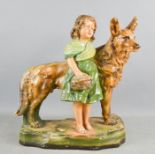 An Art Deco painted plasterwork model German Shepherd and girl.