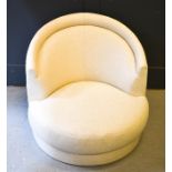 A modern cream upholstered tub chair