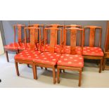 A set of eight Chinese rosewood chairs, including two carvers, and having red silk padded