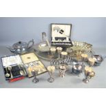 A quantity of Silver-plate to include boxed flatware , toast racks , teapot etc