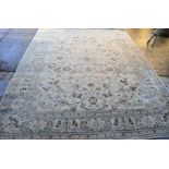 A large cream ground wool rug, 259cm by 351cm