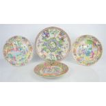 Three Chinese Famille Rose plates, 19th century, and a larger 20th century example. 24cm and 20.5cm