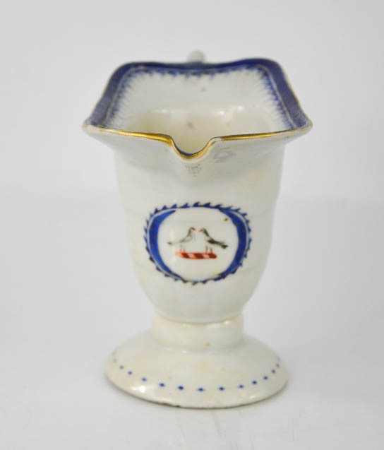 A 19th century sauce boat, bearing armorial crest with two birds, footed base, 11cm high. - Image 2 of 5