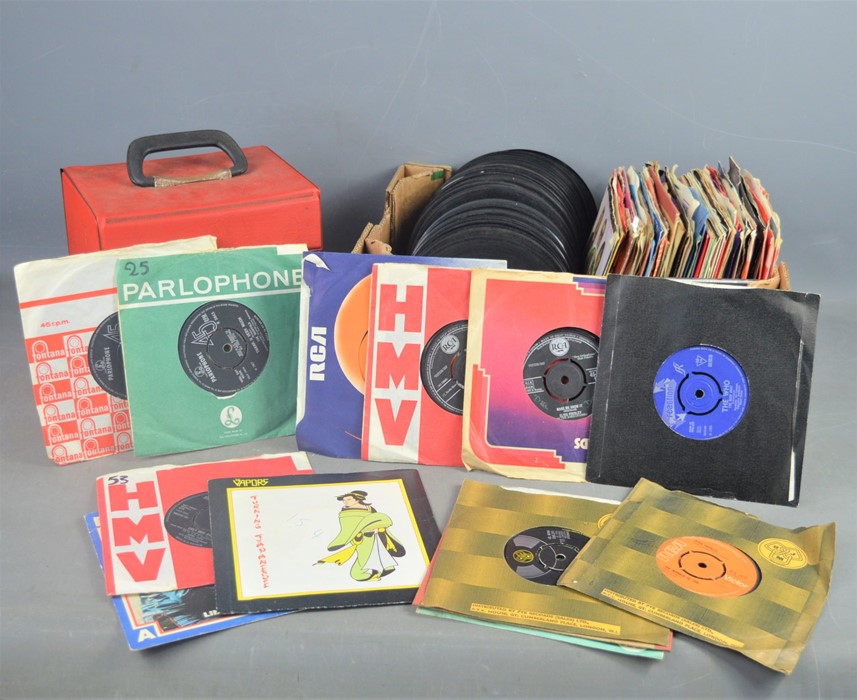 A group of 7" single records to include The Scaffold, Elvis Presley, The Vapors, The Who and many