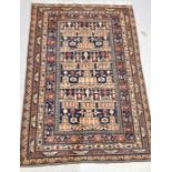 A middle Eastern blue ground wool rug with architectural pattern 98cm x 146cm