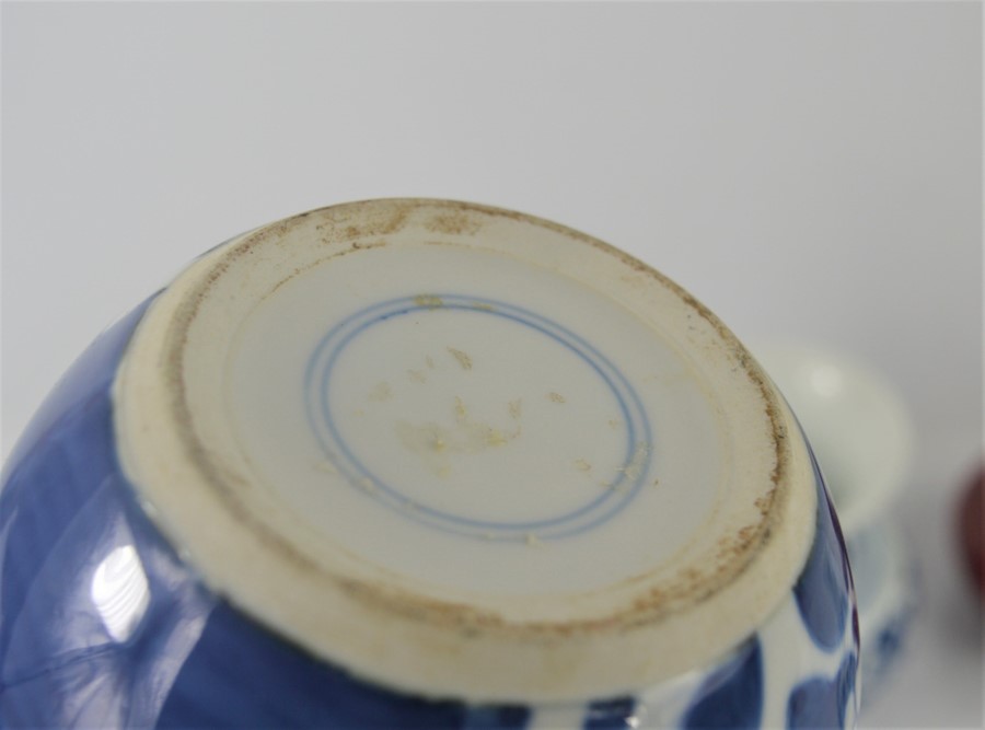 A Chinese blue and white ginger jar with Prunus decoration together with a pair of blue and white - Image 2 of 4