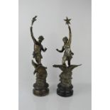 A pair of spelter 19th century figures with eagles at their feet, raised on socle bases.50cms tall x