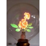 A vintage light-bulb with floral filament
