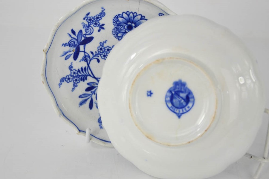 A pair of blue and white EWM&Co Meissen dishes depicting flowers, 14cm diameter. A/F - Image 2 of 2