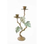 A bronzed candelabra in flower form. 20cms tall x 11cms wide