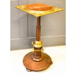 A 19th century mahogany and brass jardiniere stand.