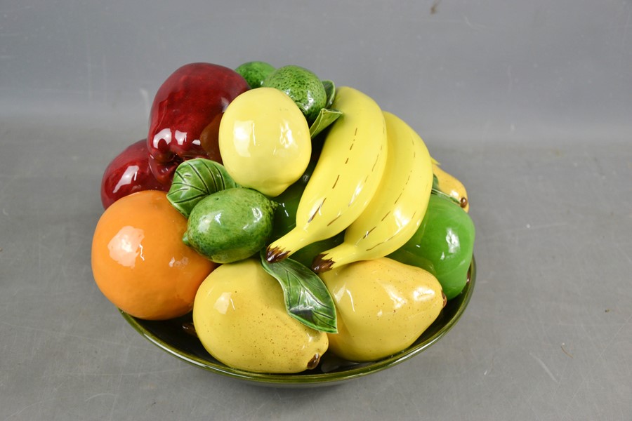 A pottery Italian majolica style model fruit bowl.