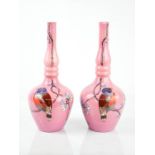 A pair of pink glass bohemian vases, hand painted with birds, 26cm high.