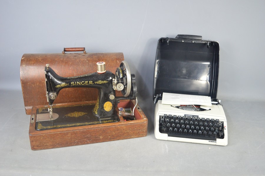 A vintage sewing machine and a 1940s typewriter.