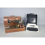 A vintage sewing machine and a 1940s typewriter.