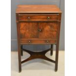 A 19th century mahogany pot cupboard, with single drawer above two cupboard doors, and drawer below,