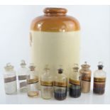 A Group of vintage apothecary jars with labels together with a Doulton Lambeth stoneware glazed jar,