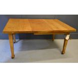 An oak extending dining table with winder, 147cm by 104cm by 74cm