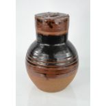 A Studio ware stone glazed bottle and cover, the cover embossed with design. 28.5cm