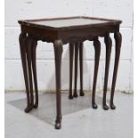 A nest of three mahogany tables, 56 by 50 by 39cm.