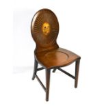 A late Georgian mahogany hall chair oval fluted back and tapered legs.