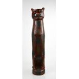 A large wooden painted and carved cat, 61cm high.