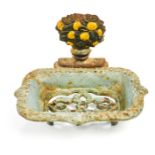 An antique painted cast iron soap dish.