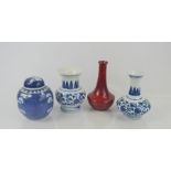 A Chinese blue and white ginger jar with Prunus decoration together with a pair of blue and white