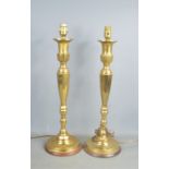 A pair of brass Art Deco style table lamps with shades, 56cms tall, together with 2 Victorian copper