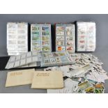 Five albums of vintage cigarette cards, mostly sets, together with a loose group of cigarette