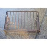 A large iron wall mounted hay rack. 106cms wide