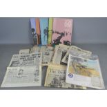 A large group of WWII related newspapers and WWI reproduction newspapers