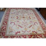 A large Turkish rug, cream ground, 330cm by 280cm