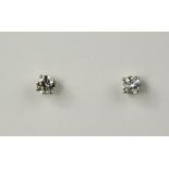 A pair of platinum and diamond stud earrings, 0.80ct total, HVS2 in GIA Certificate, 1.6g.