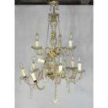 An antique French cut glass chandelier, with two tiers.