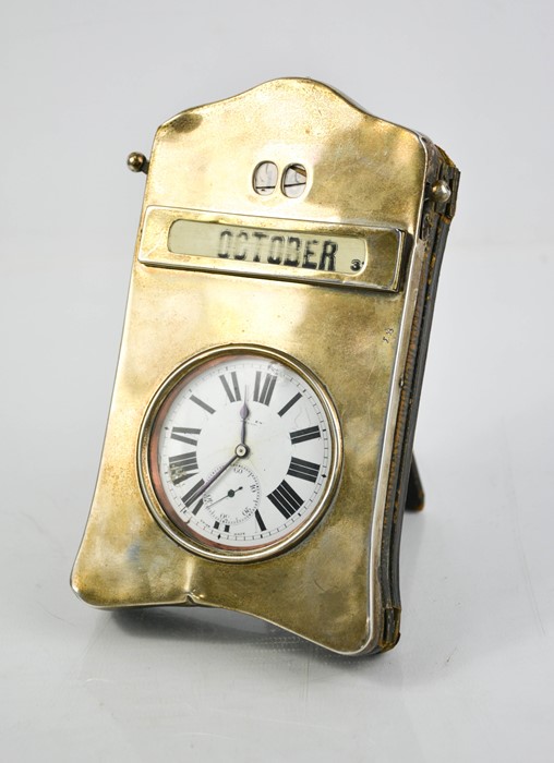 A silver desk calendar pocket watch holder, containing pocket watch with Roman numeral dial, the