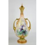 A Royal Worcester vase and cover with twin handles, painted with sweet peas, and signed A Shuck,