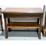 A mahogany hall table with two drawers, with carved decoration by Edward & Roberts, stamped to the