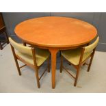 A 1960s McIntosh dining table and four chairs with makers label. 120cms diameter x 76cms high