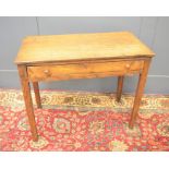 An oak country side table with single drawer, 69cms tall x 85cms x 44cms