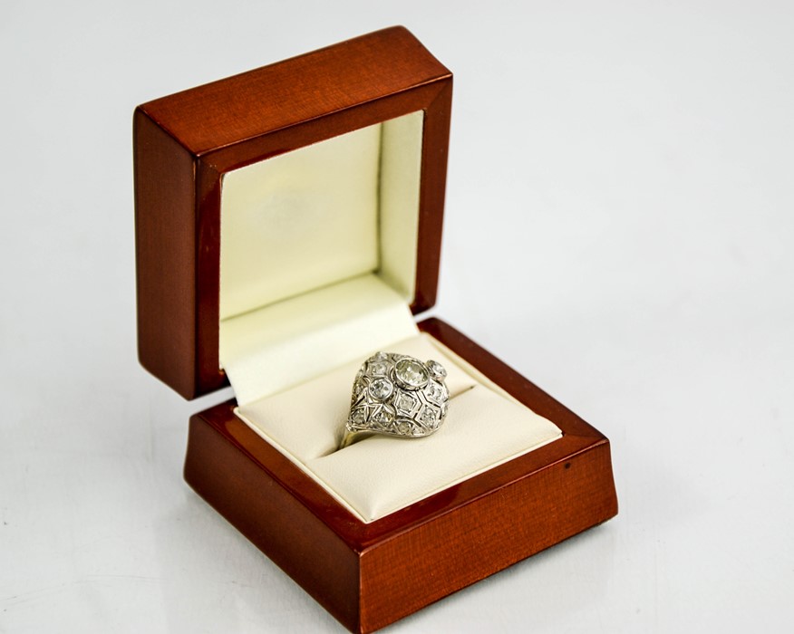 An Art Deco diamond and platinum ring, the central diamond approximately 0.8cts, flanked by two - Image 2 of 8