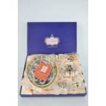 A Royal Crown Derby miniature tea set, in the original presentation box, comprising teapot, milk