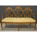 A 19th century satinwood and floral polychrome painted settee, the triple arched back painted with