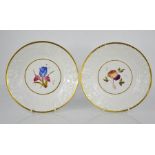 A pair of Chamberlains Worcester dishes, with raised flower borders with gilt rims, the centres