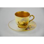 A Royal Worcester cup and saucer, by Earnest Barker with painting of sheep in landscape, signed,